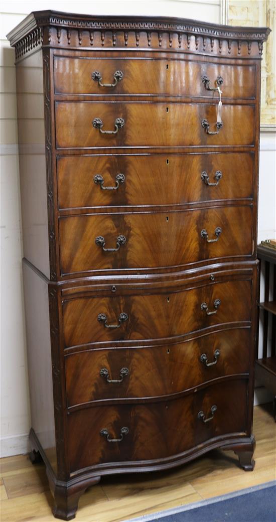 A George III style mahogany serpentine chest on chest W.88cm